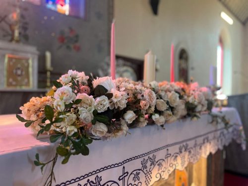 Flower arrangement on church altar close up by Rosewater Decor