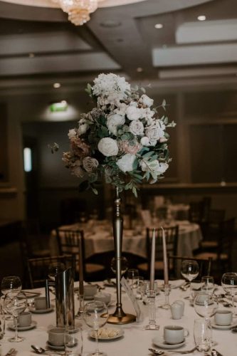 Flower stand on wedding table close up by Rosewater Decor